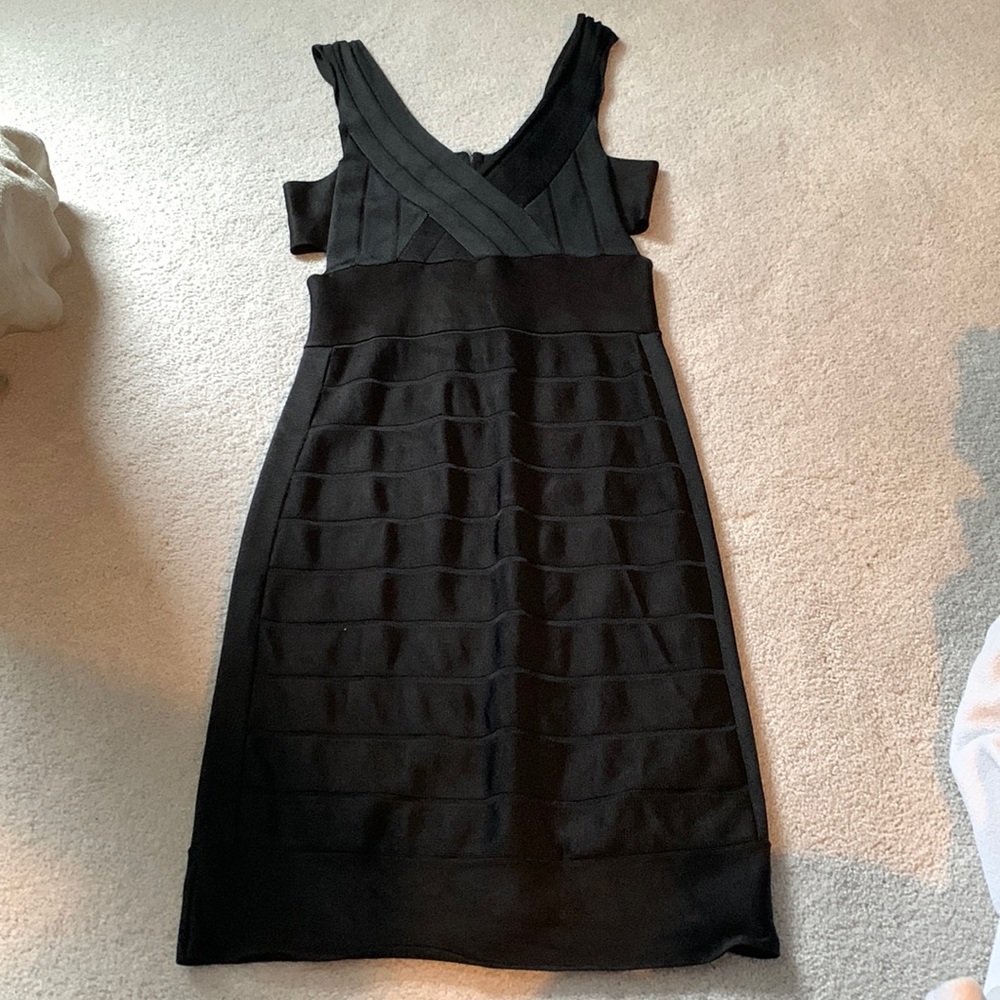 LBD, form fitting but comfortable, side cutouts around ribcage area